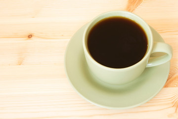cup of coffee isolated on a wooden texture