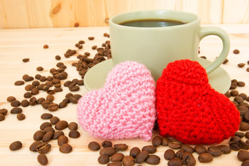 cup of coffee and knitted valentine's hearts