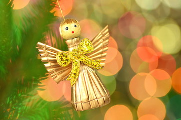 dekoracja bożonarodzeniowa, figurka aniołka na tle bokeh - obrazy, fototapety, plakaty