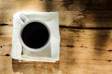 instant coffee in white cup against wood background