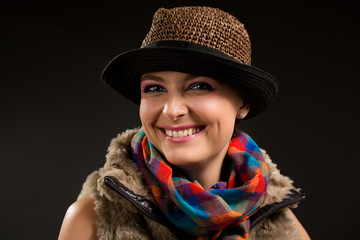 portrait of the girl in a hat and a scarf