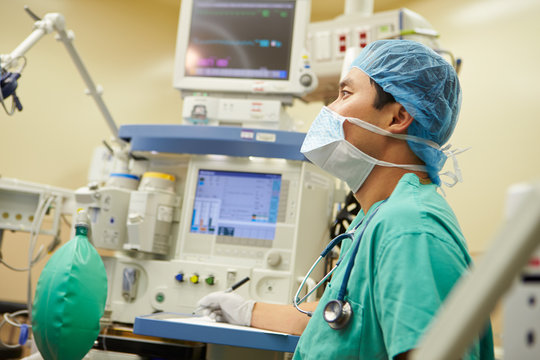 Anesthetist Working In Operating Theatre