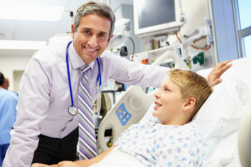 Boy Talking To Male Consultant In Emergency Room