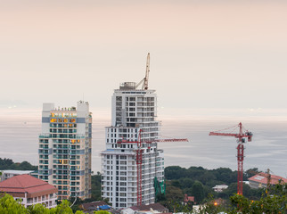 buildings under construction and cranes