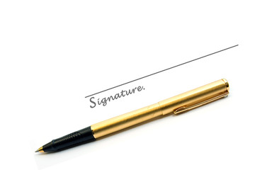 Gold pen and signature isolated on white