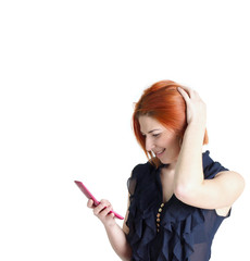 Naklejka premium Emotional happy woman with red hair and a telephone