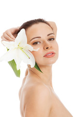 Beautiful topless woman with white lily.