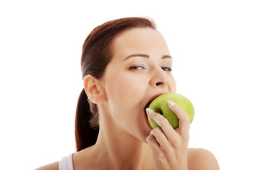 Beautiful woman eating an apple.