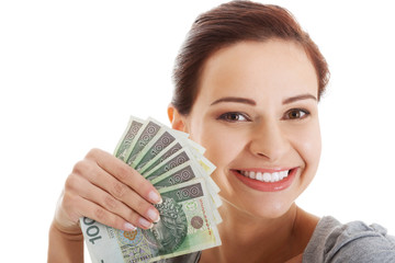 Beautiful casual woman holding money.