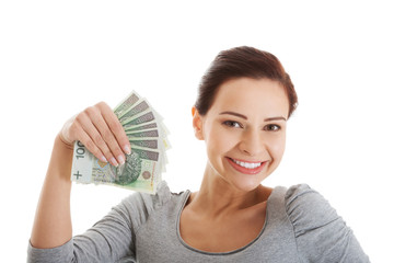 Beautiful casual woman holding money.