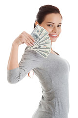 Beatiful casual woman holding money.