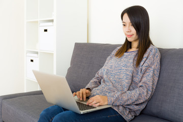 Asian woman working at home