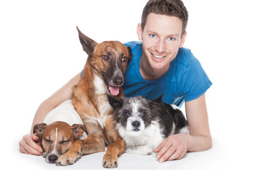 dog owner and three dogs