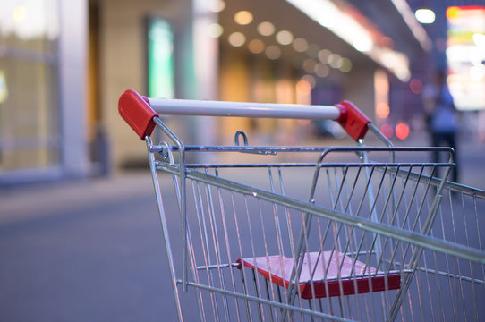 Shopping cart handlebar at entrance of supermarket