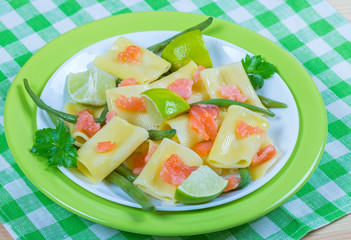 Pasta with salmon and green beans. Italian cuisine
