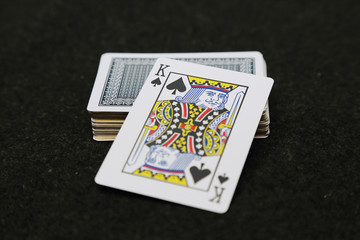 black spade king card on the top of card deck