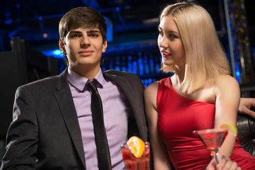 Young couple talking in a nightclub