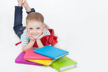 Boy and books isolated on a white background