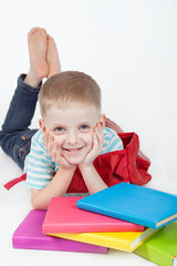 Boy and books isolated on a white background