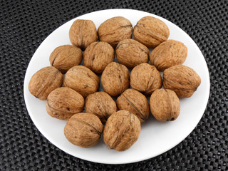 Walnuts on a white plate
