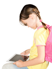 Little school girl use her tablet