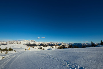 Morning on a ski slope of Dolomiti, italy