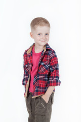 Portrait of happy boy with hands in pockets isolated on white ba