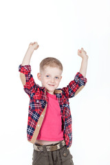 Portrait of happy boy with hands in pockets isolated on white ba