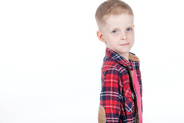 Portrait of happy boy with hands in pockets isolated on white ba
