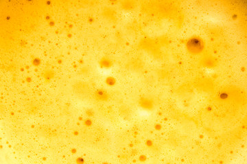 Creamy foam in the coffee as a background