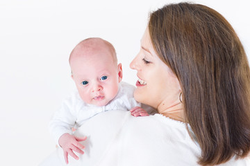 Happy young mother holding her newborn baby