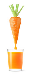 Isolated carrot juice. Carrot over glass of fresh juice isolated on white background