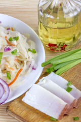 Marinated cabbage (sauerkraut) and pieces of lard
