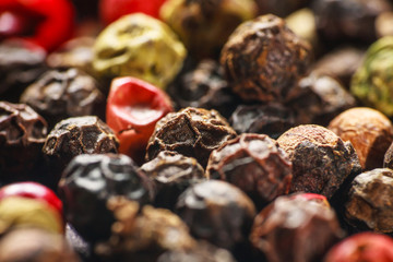 pepper corns on a wooden board