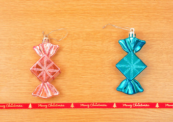 Fototapeta premium Candy shaped Christmas decorations with red ribbon