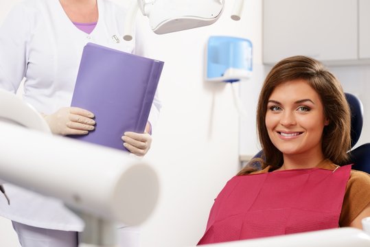 Young beautiful brunette woman at dentist's surgery