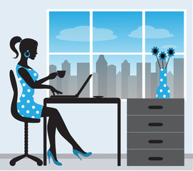 silhouette of a woman with a laptop