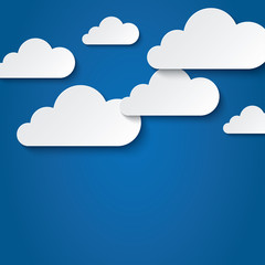 Paper clouds on blue background. Paper sky.