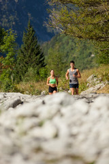 Young sporty couple is doing running exercises
