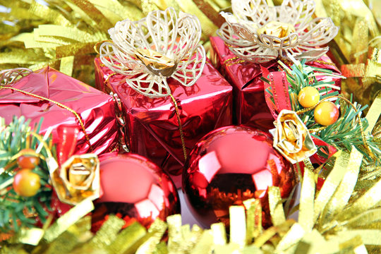 Golden ribbon and red gift box.