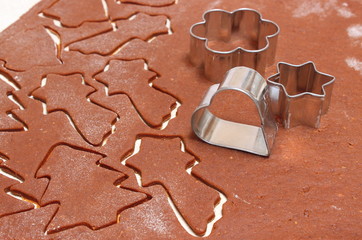 Gingerbread dough for Christmas cookies and cookie cutters