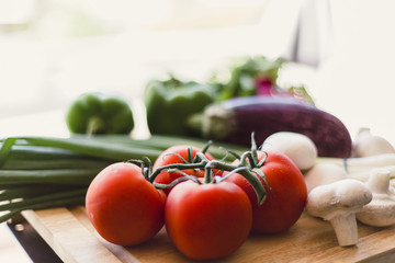 Fresh vegetables on wooden chopping board
