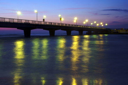 pier and beach in Kolobrzeg by night, Poland