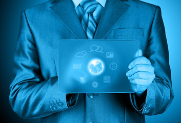 Businessman pressing icon  glass tablet