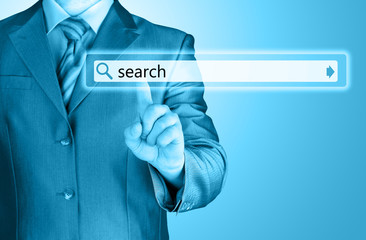 Businessman pushing virtual search bar