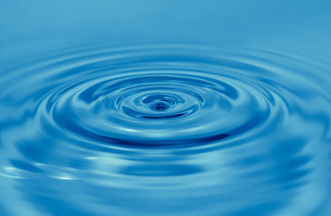 Naklejka na ściany i meble a drop of water falls in the blue. macro...