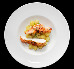 Chicken breast with potatoes on plate