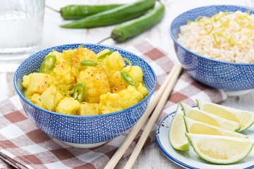 vegetable curry with lime and mint in a bowl