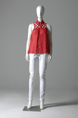 Mannequin dressed in red shirt and trousers