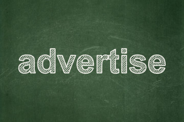 Obraz premium Marketing concept: Advertise on chalkboard background